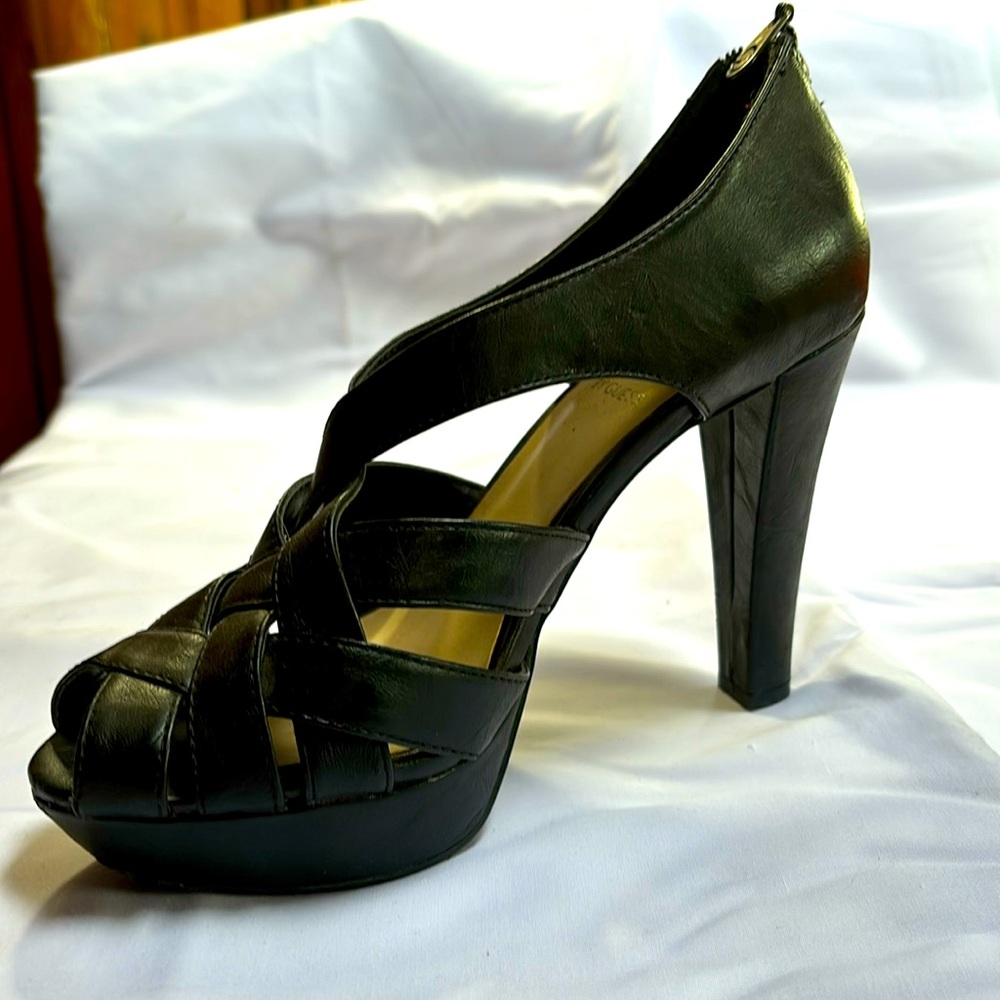 GUESS brand black leather heels.